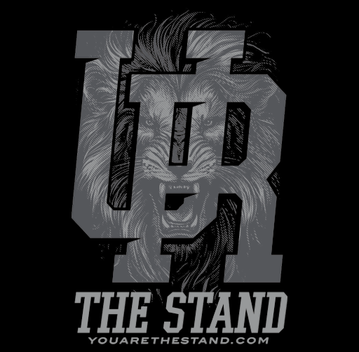 "YOU ARE", apparel design featuring a lion's face overlaid with the text 'THE STAND' and the website 'youarethestand.com'.
