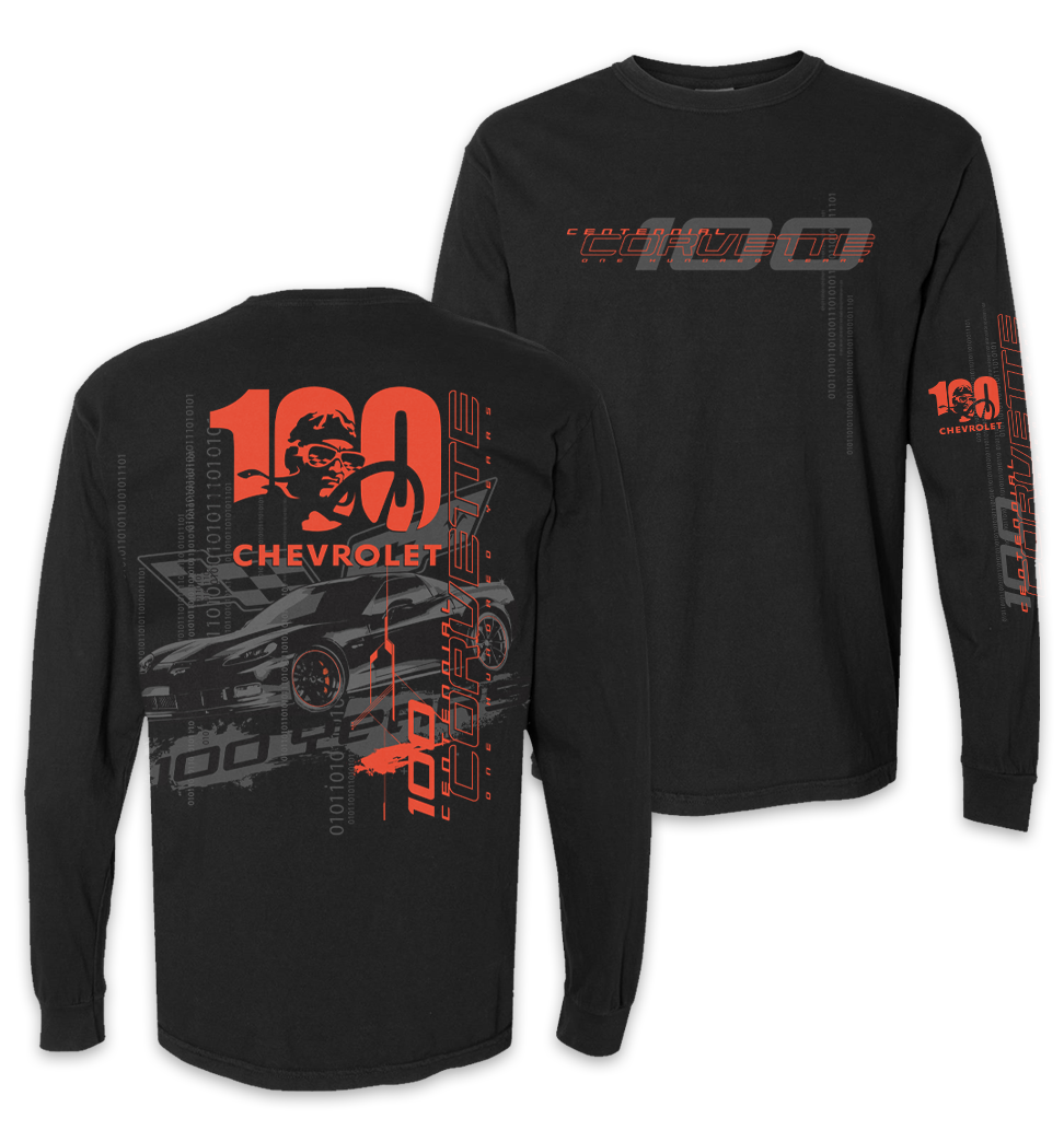 Black long sleeve Chevrolet 100th anniversary Logo shirt with graphic design of a Corvette racing car, a driver wearing sunglasses and helmet, and various text elements in red and gray.