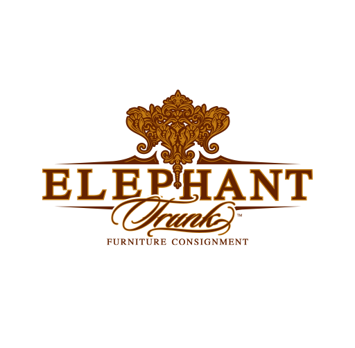 Logo for Elephant Trunk Company featuring a gold ornate elephant head above the company name in large brown letters, with the motto "Furniture Consignment" underneath.