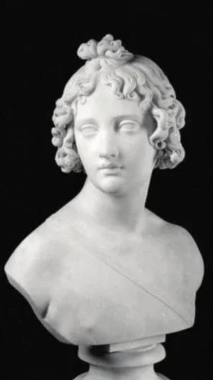 Fig.8) John Gibson (1790 – 1866), Bust of Cupid, white marble. Collection of Lord Garlis.