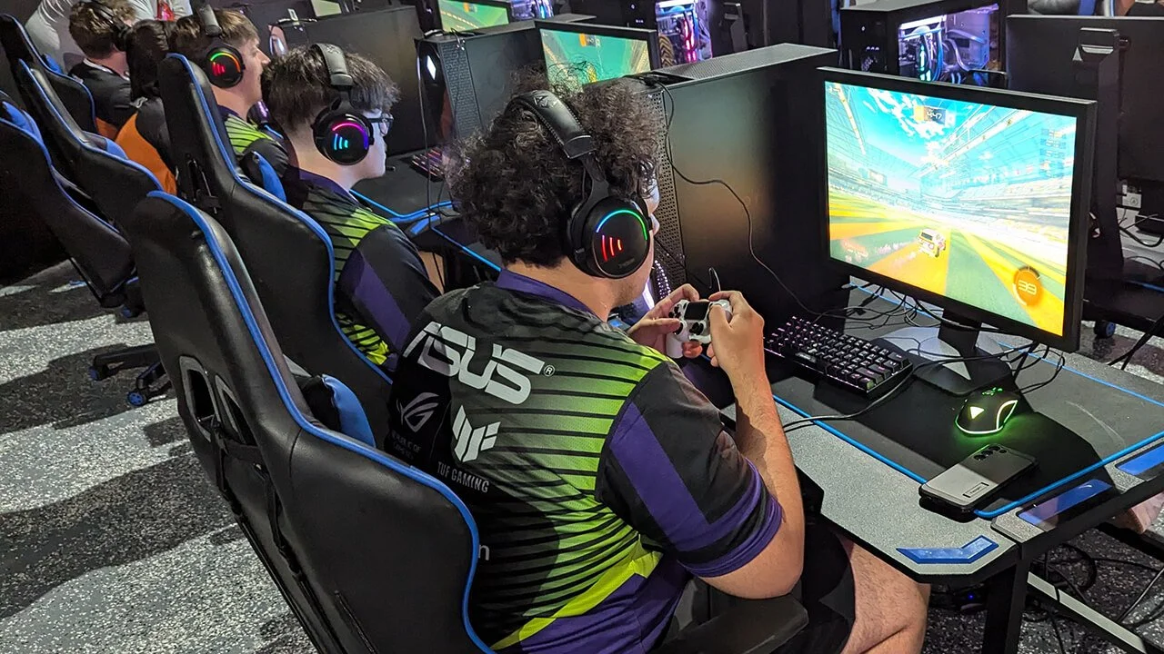 A team of players focused on esports, enjoying a competitive video game session in Orlando Florida.