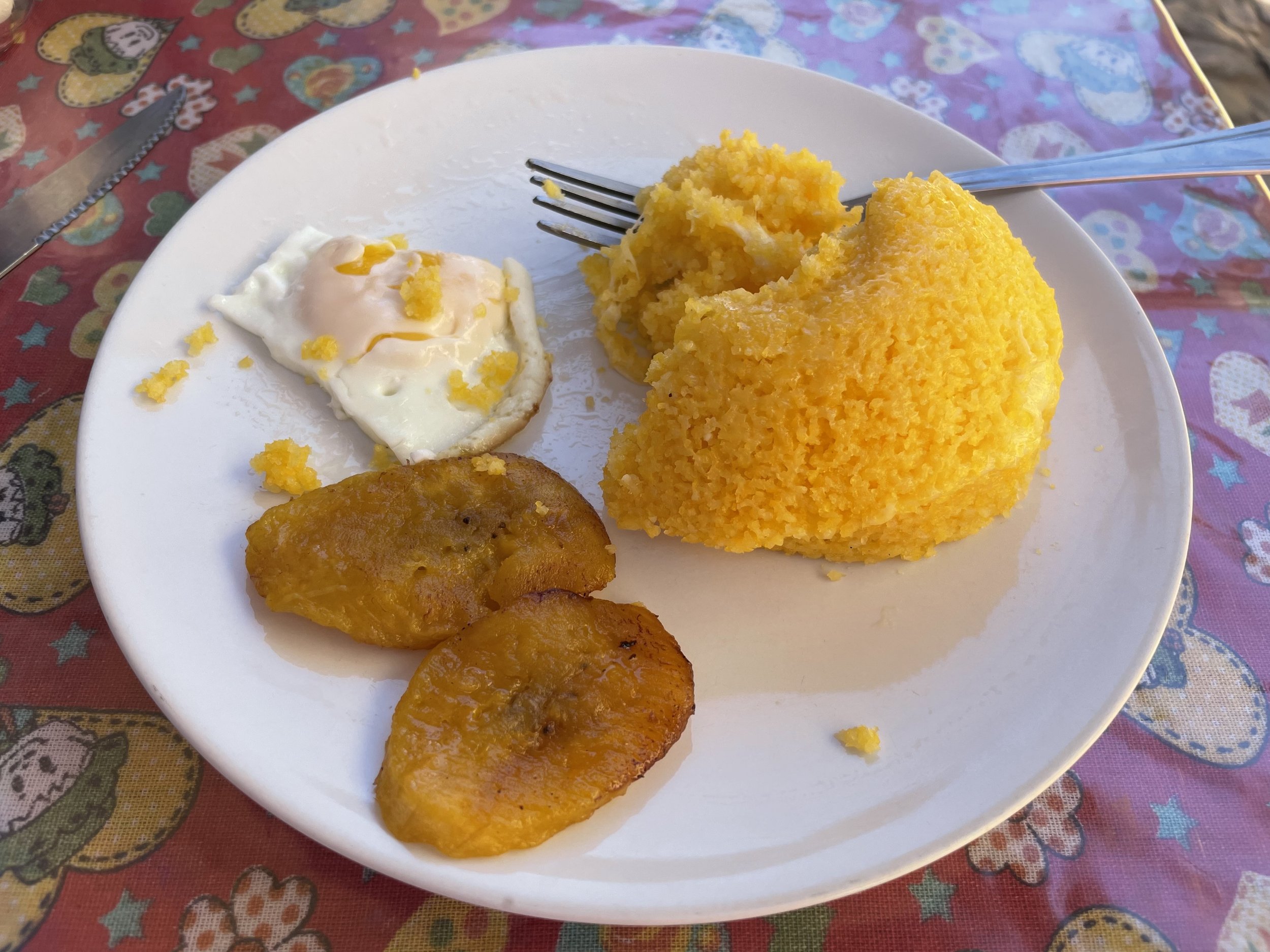 Cuscuz: The simplest can be the best. Corn meal is steamed and served with eggs and fried plantains.