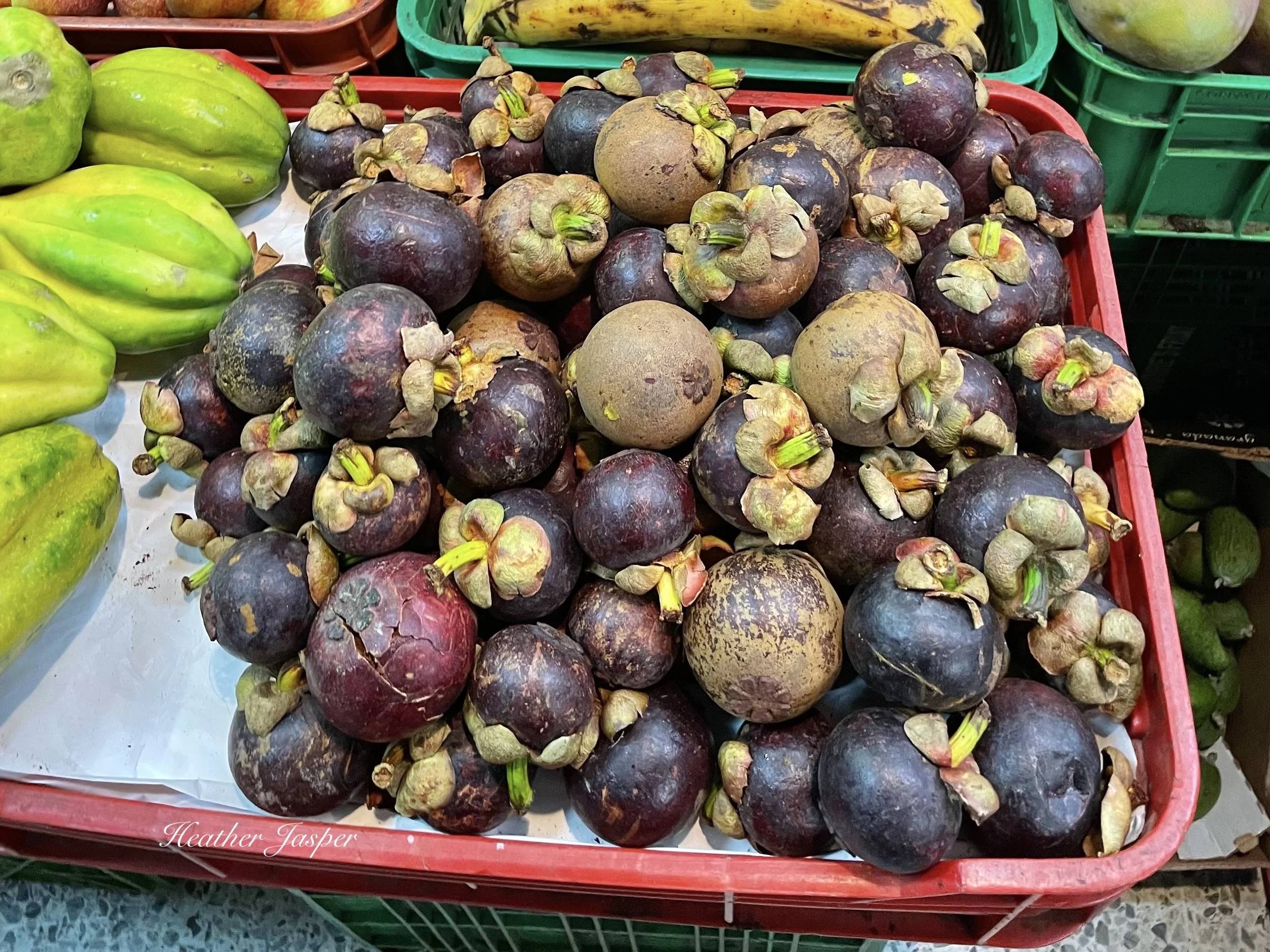 mangosteens at the market in Bogota Colombia