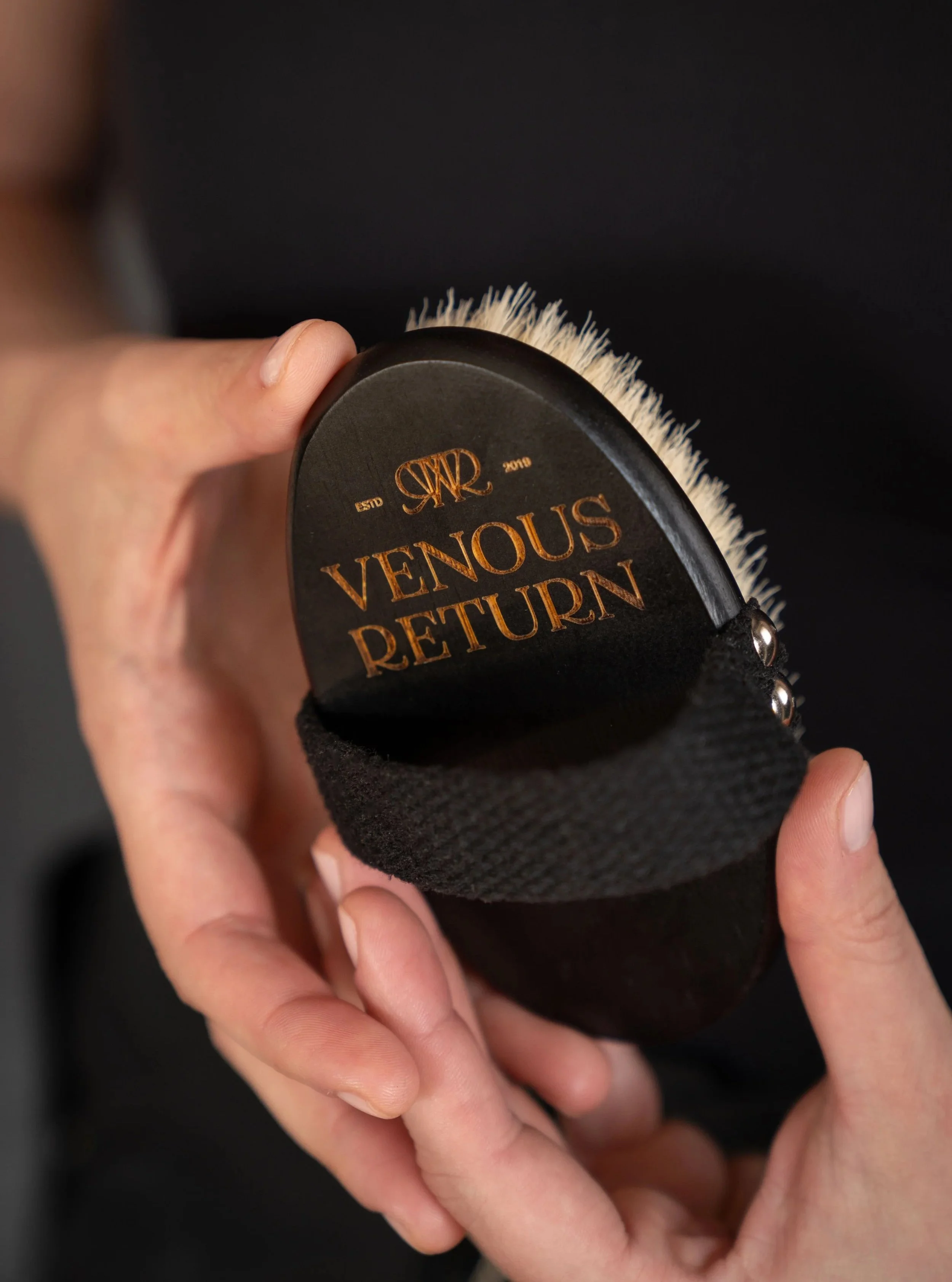 Venous Return Healing's Body Dry Brush for lymphatic drainage self massage held by licensed massage therapist Lorna Skuraton.