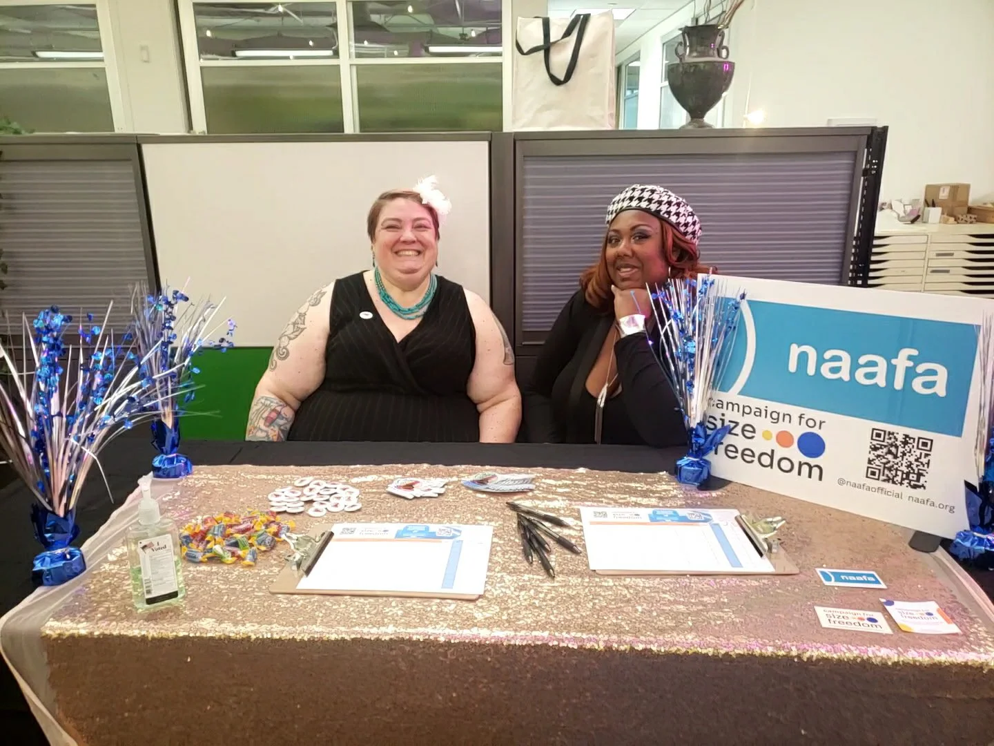 Photo of Dawn and Pucks at a NAAFA info table