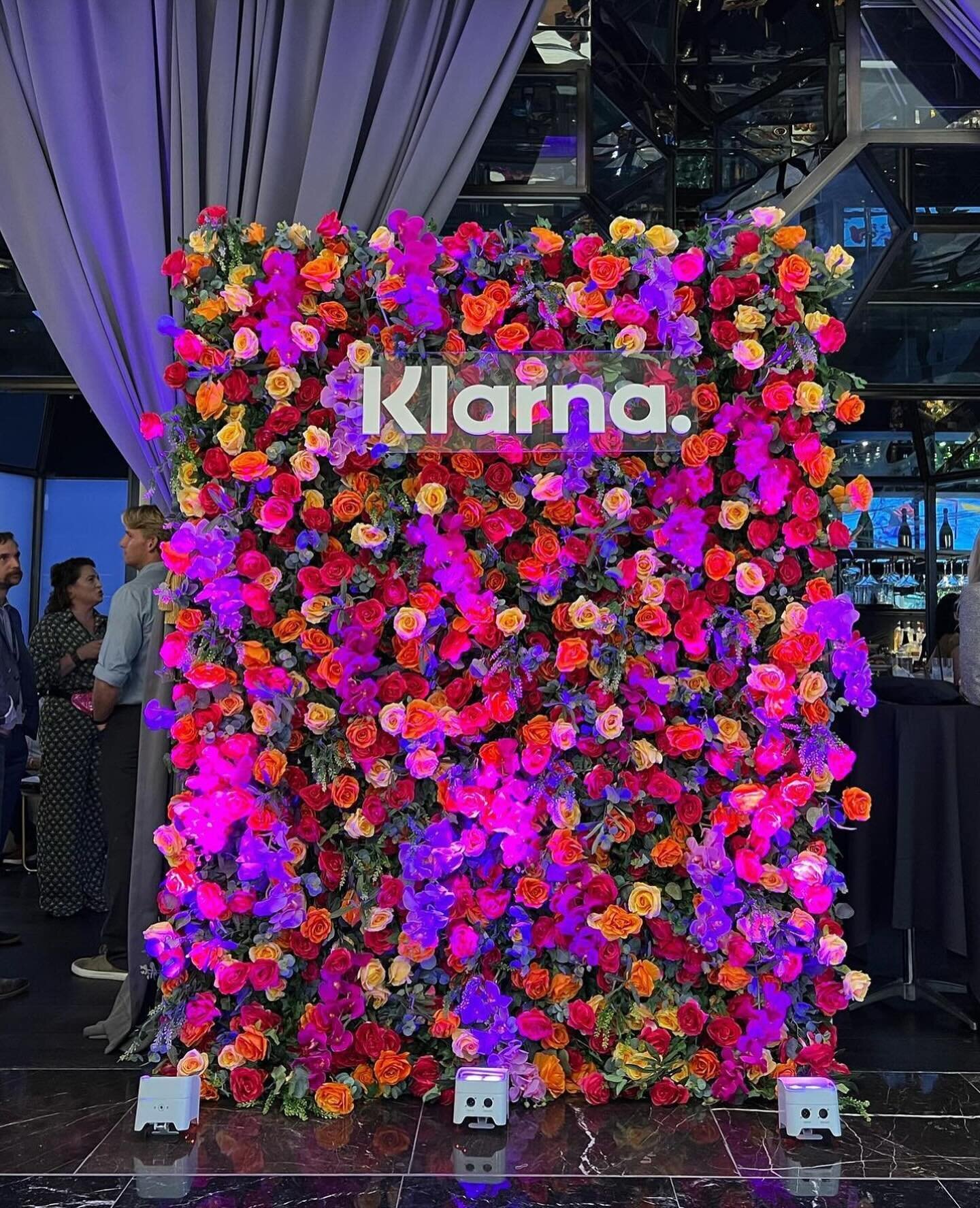Still searching for a show stopping backdrop for your wedding or event? Look no further! 🙋&zwj;♀️ A vibrant blend of purple, yellow, red, orange, and lavender orchids and roses mixed with dark green foliage. 🌺 This tropical flower wall will add a p