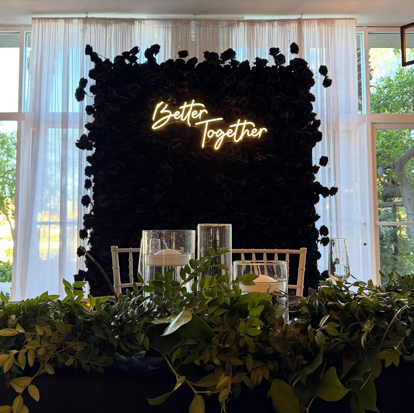 A dark and mystical flower wall. 🖤 This black rose flower wall is fun, ritzy, spooky, and grungy all in one! Our Black Widow flower wall is perfect for birthdays, Halloween, graduation, Raiders parties, and corporate events. Designer Flower Walls #f