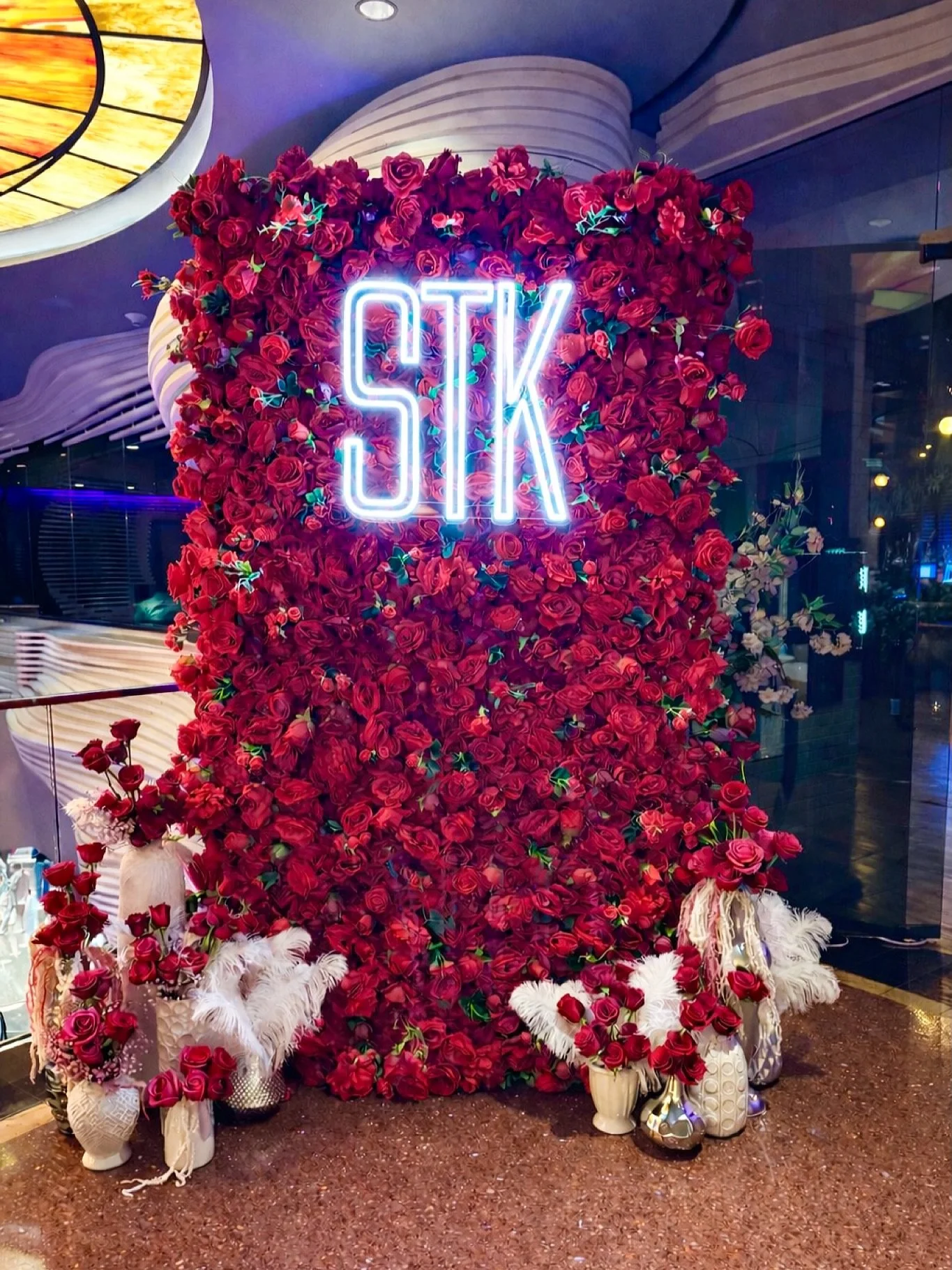 We &hearts;️ our repeat clients! Thank you for your continued support @eatstk!! 🙏 A bold and romantic flower wall. This jaw dropping flower wall has a varying shades of red roses, peonies and green foliage. Our Moulin Rouge flower wall is perfect fo