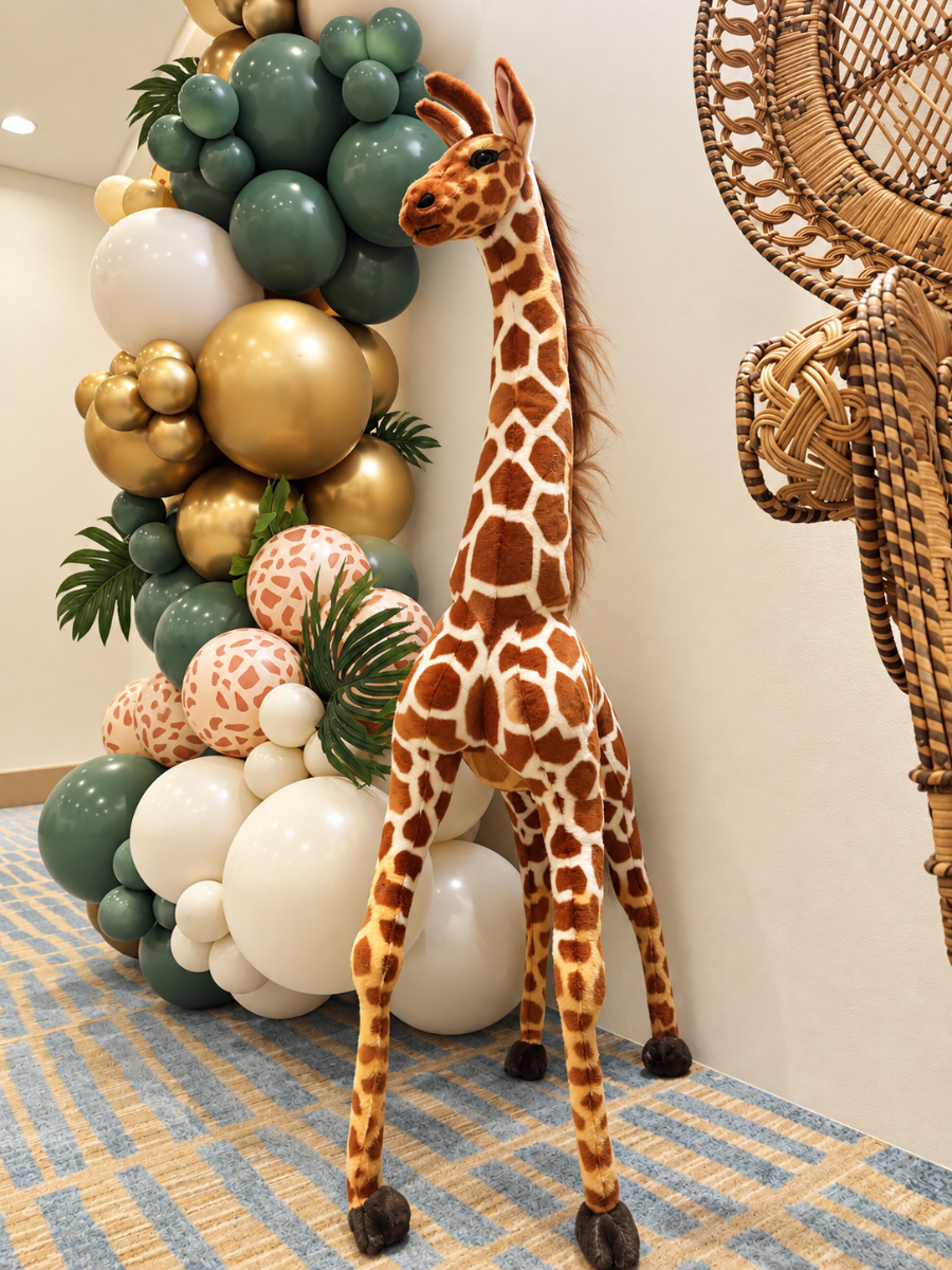 **Image Alt Tag:** 47-inch baby giraffe plush prop rental for safari and jungle-themed events in Las Vegas | Flower Walls Las Vegas