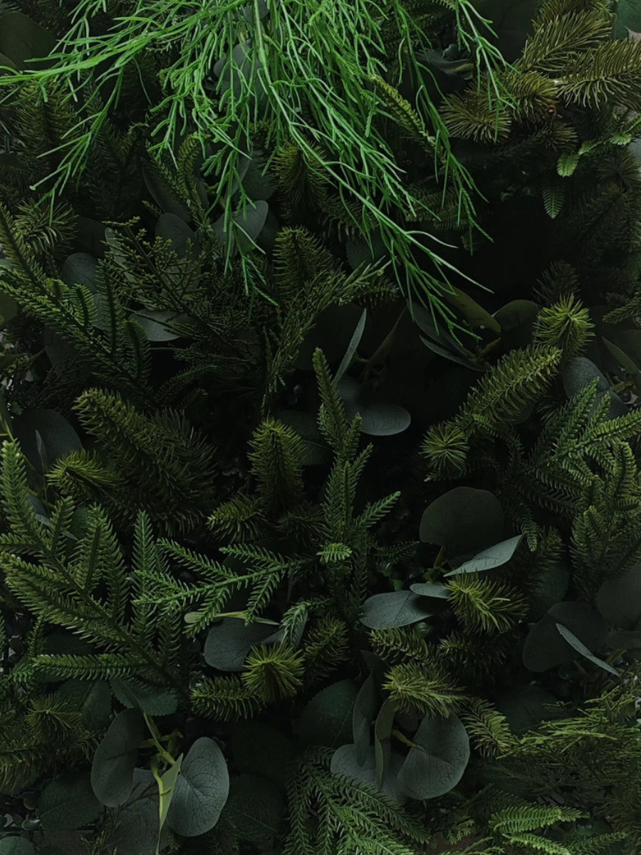**Evergreen Oasis greenery wall by Flower Walls Las Vegas, featuring lush layered greenery, ferns, eucalyptus and evergreen foliage for luxury weddings, Christmas parties and elegant events in Las Vegas.