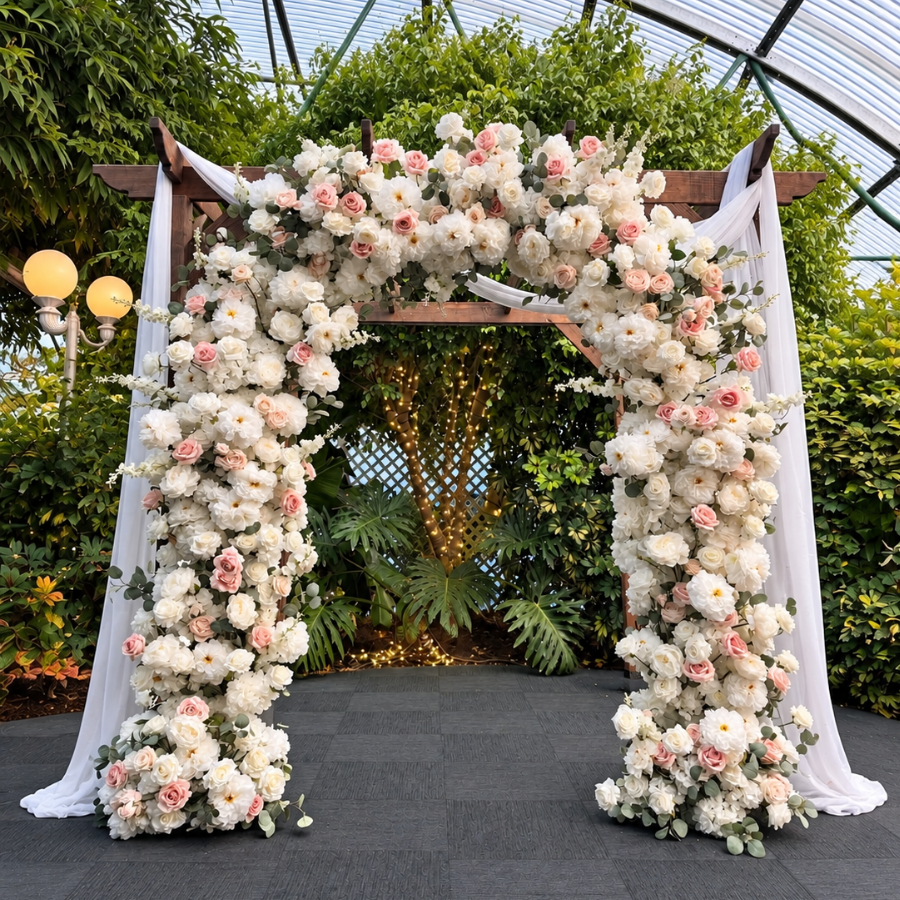 Always & Forever floral wedding arch with white and blush flowers, sheer draping, and eucalyptus greenery in Las Vegas