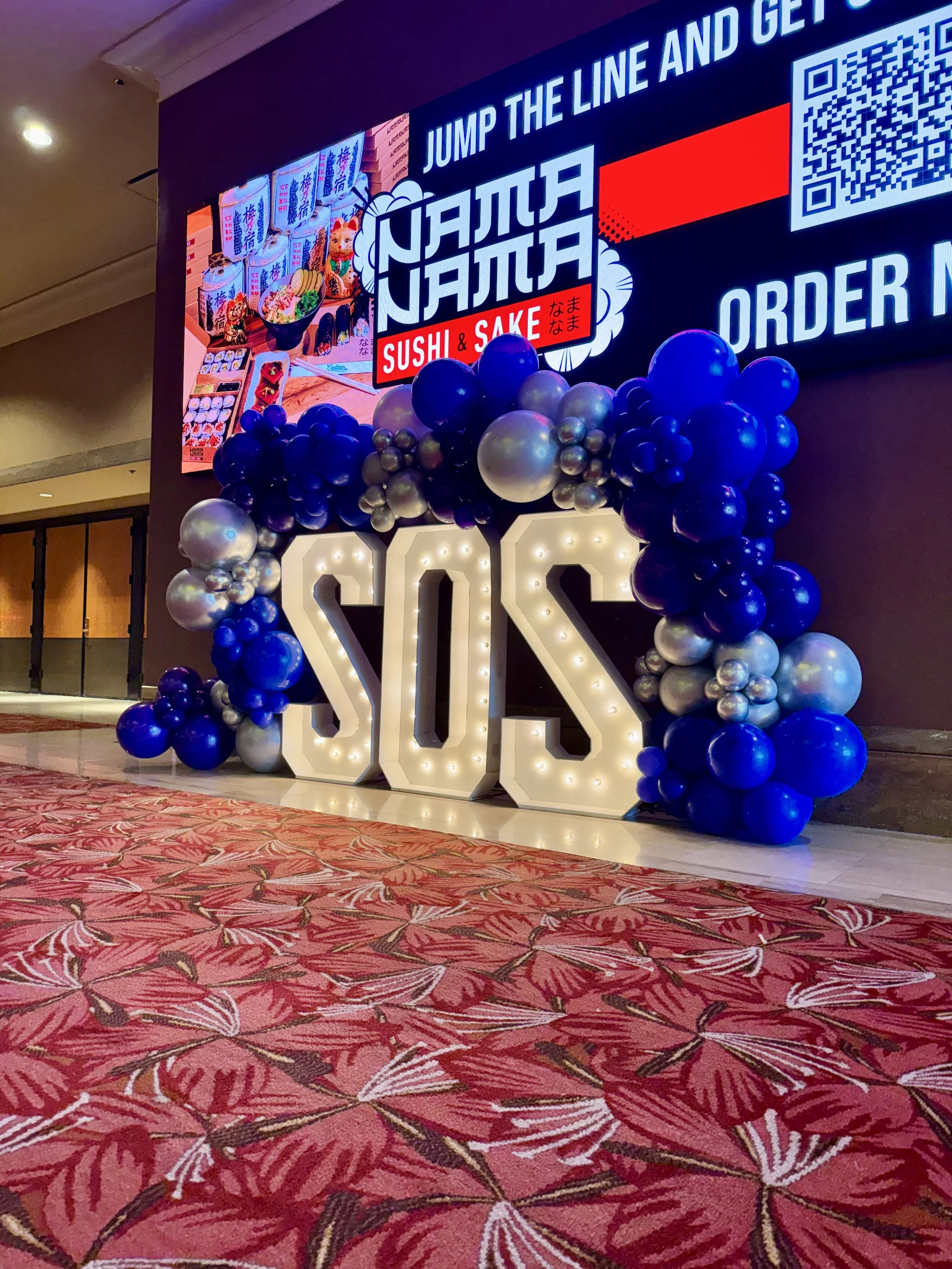 sos marquee letters with balloon garland balloon decor Las Vegas flower walls Las Vegas