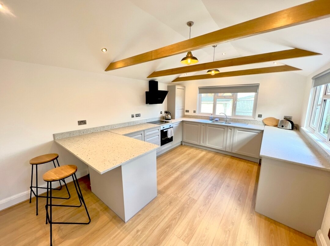 This stunning kitchen built into the extension of a typical weather-boarded fisher-mans cottage at Heybridge Basin is a perfect example of how old and new can work together seamlessly!