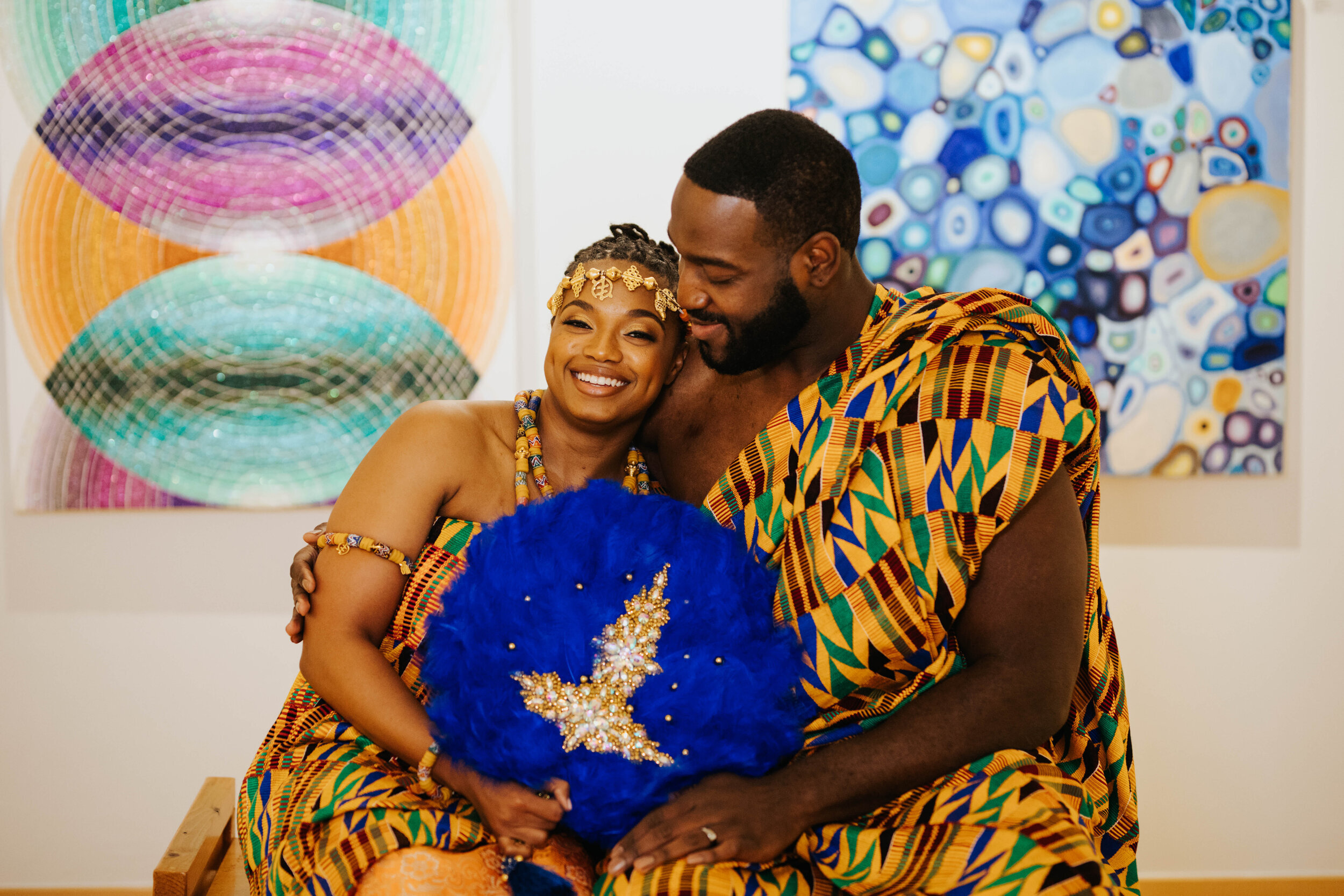 Bride and groom dressed in traditional African clothing in Richmond VA Shawnee Custalow Queer Wedding Photographer