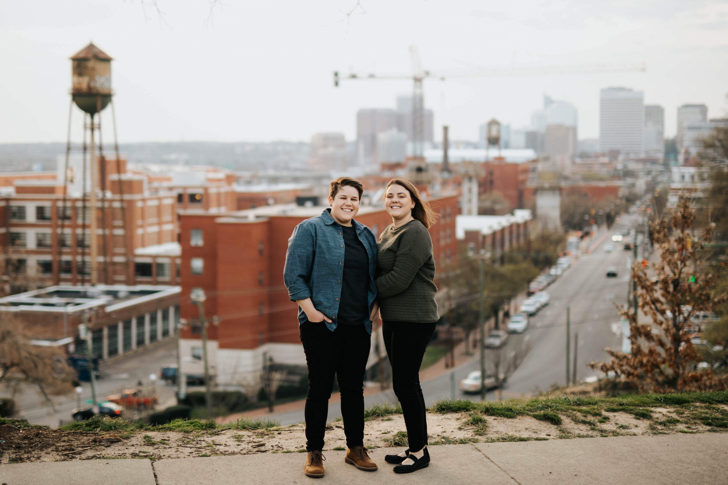 Engaged LGBTQ couple posing together at Libbie Hill Park Shawnee Custalow Queer Wedding Photographer