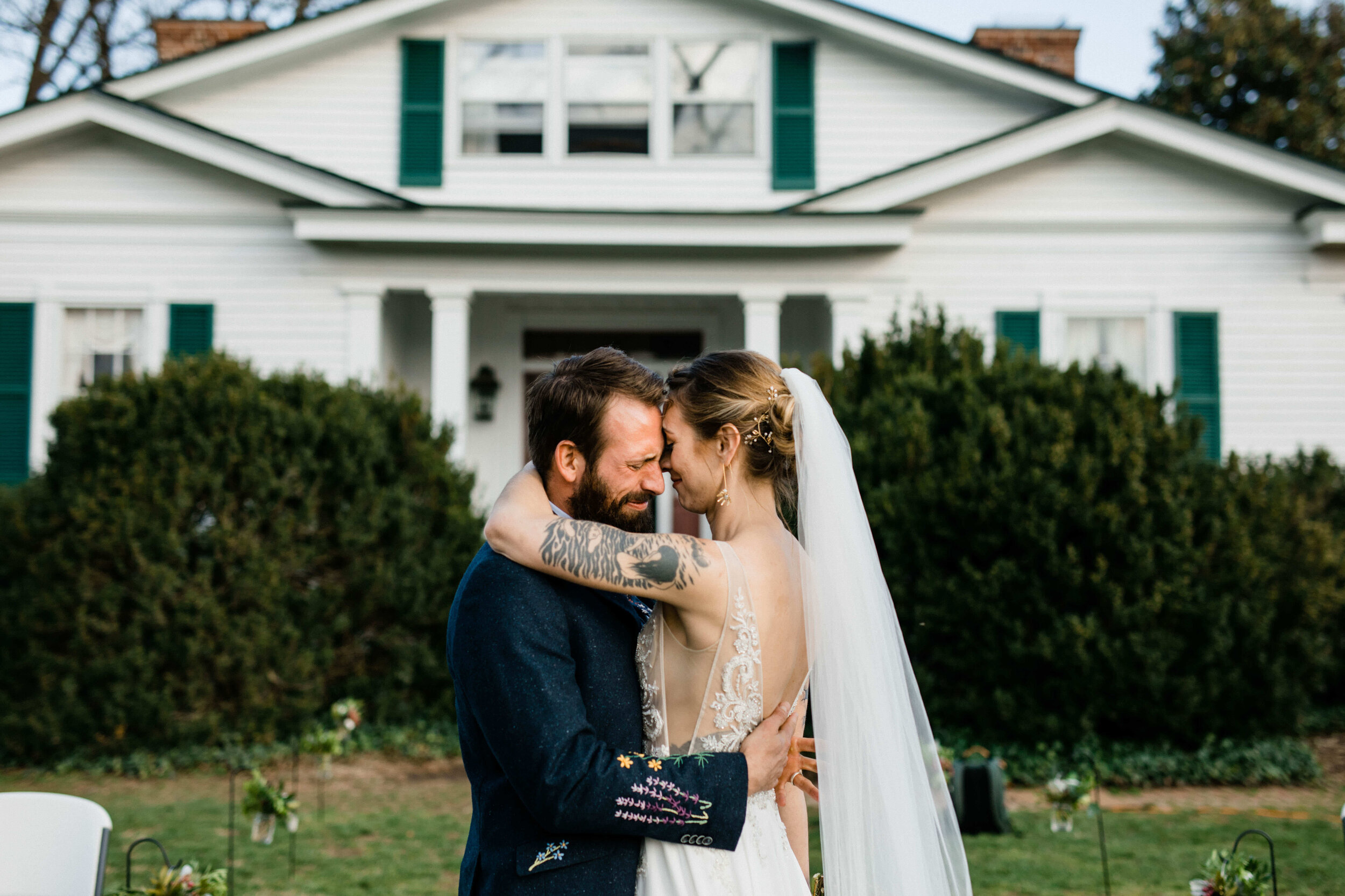 Bride and groom emotionally embracing outside in Richmond VA Shawnee Custalow Queer Wedding Photographer