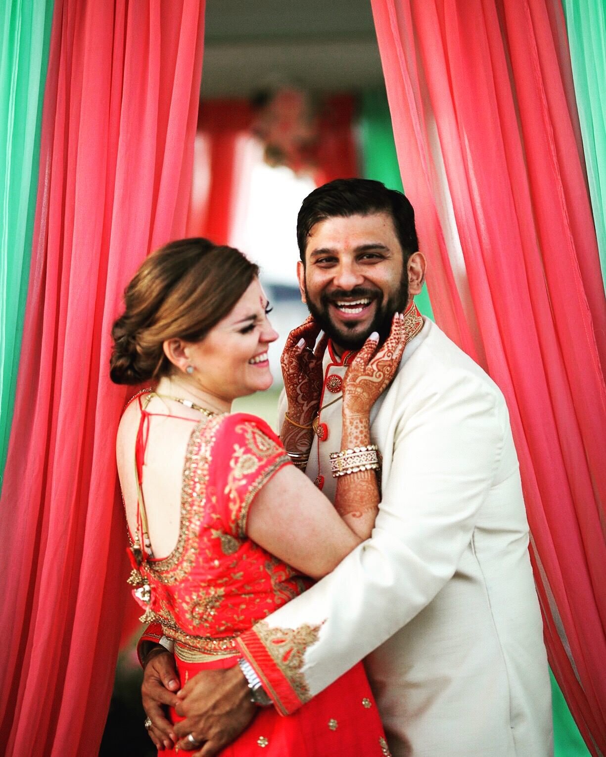 Multicultural newlywed couple in traditional Indian wedding attire and henna in RVA Shawnee Custalow Queer Wedding Photographer