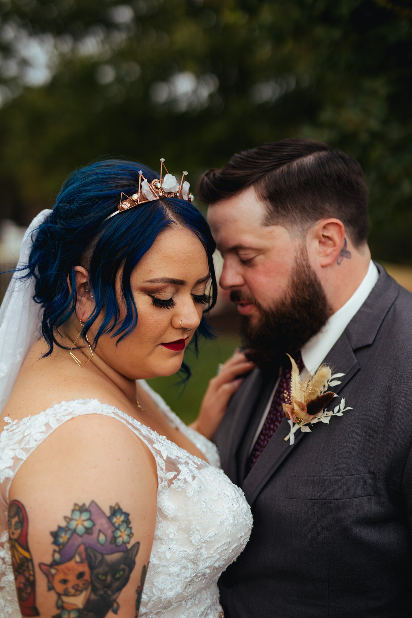 Bride and groom intimately posing with their eyes closed in RVA Shawnee Custalow Queer Wedding Photographer