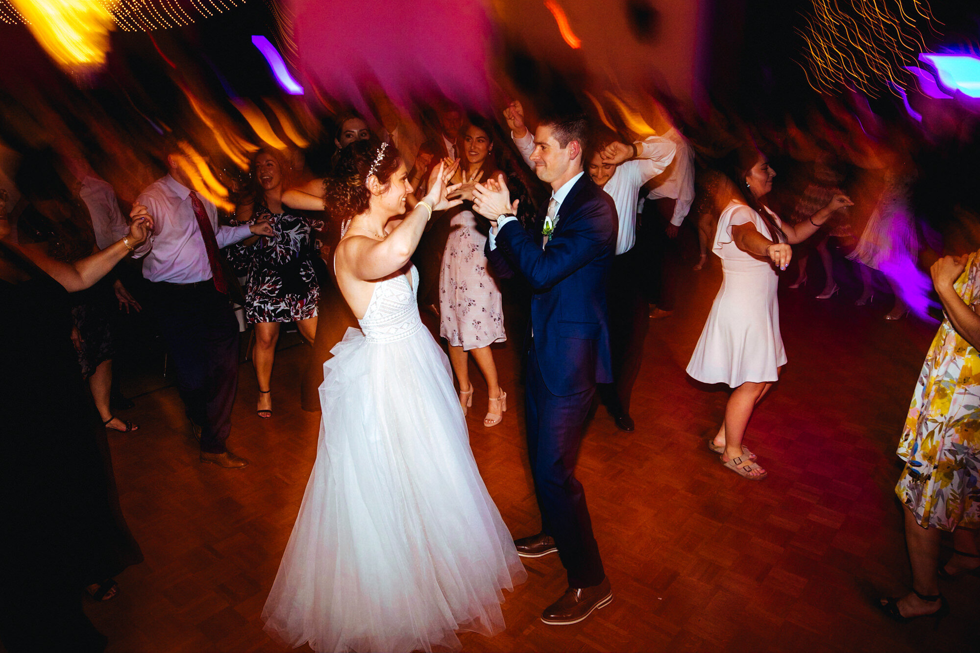 Newlywed couple dancing at their wedding reception in Richmond VA Shawnee Custalow Queer Wedding Photographer