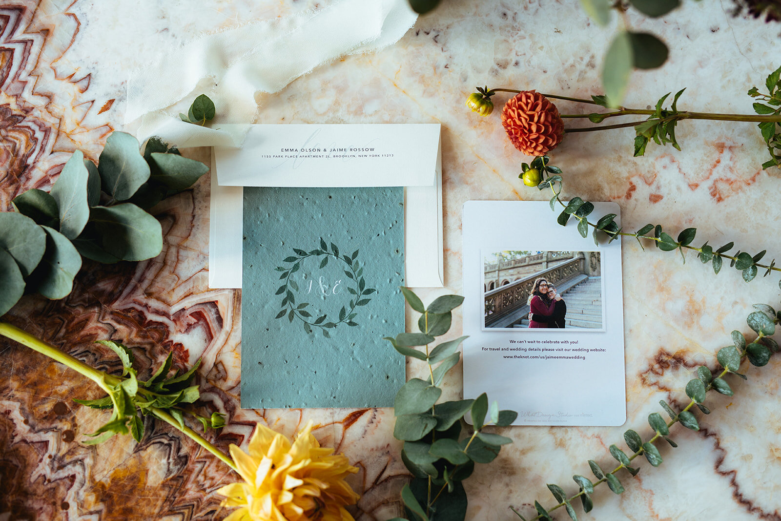 Monogram wedding stationary on marble backdrop in Brooklyn Shawnee Custalow Queer Wedding Photographer