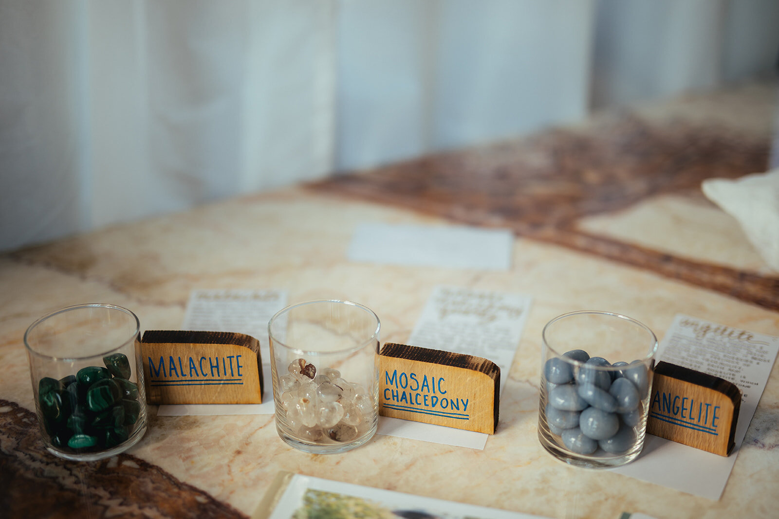 Crystals in cups with labels for wedding guests in Marlow Events Red Hook Brooklyn Shawnee Custalow Queer Wedding Photographer