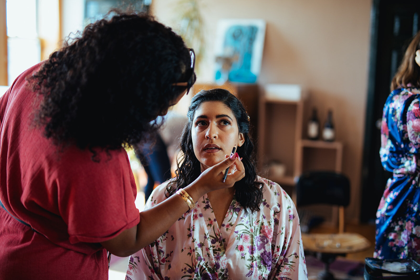 Bride having her make up done in Red Hook Brooklyn Shawnee Custalow Queer Wedding Photographer