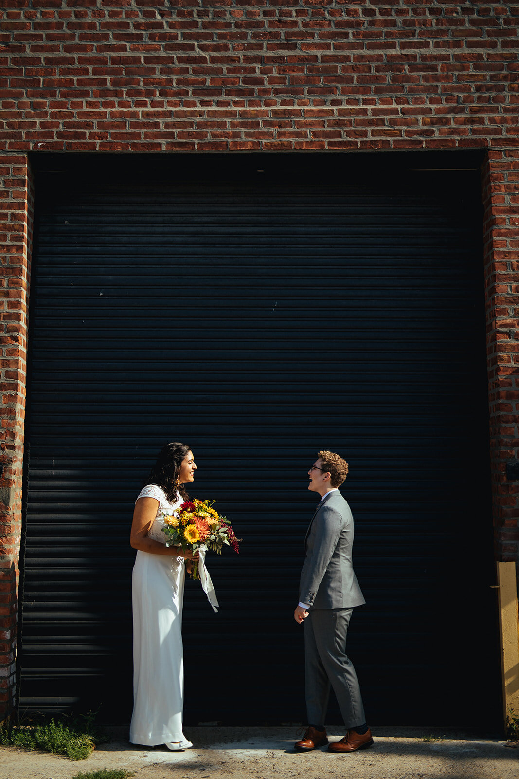 Queer couple having their first look before marrying in Brooklyn NYC Shawnee Custalow Queer Wedding Photographer