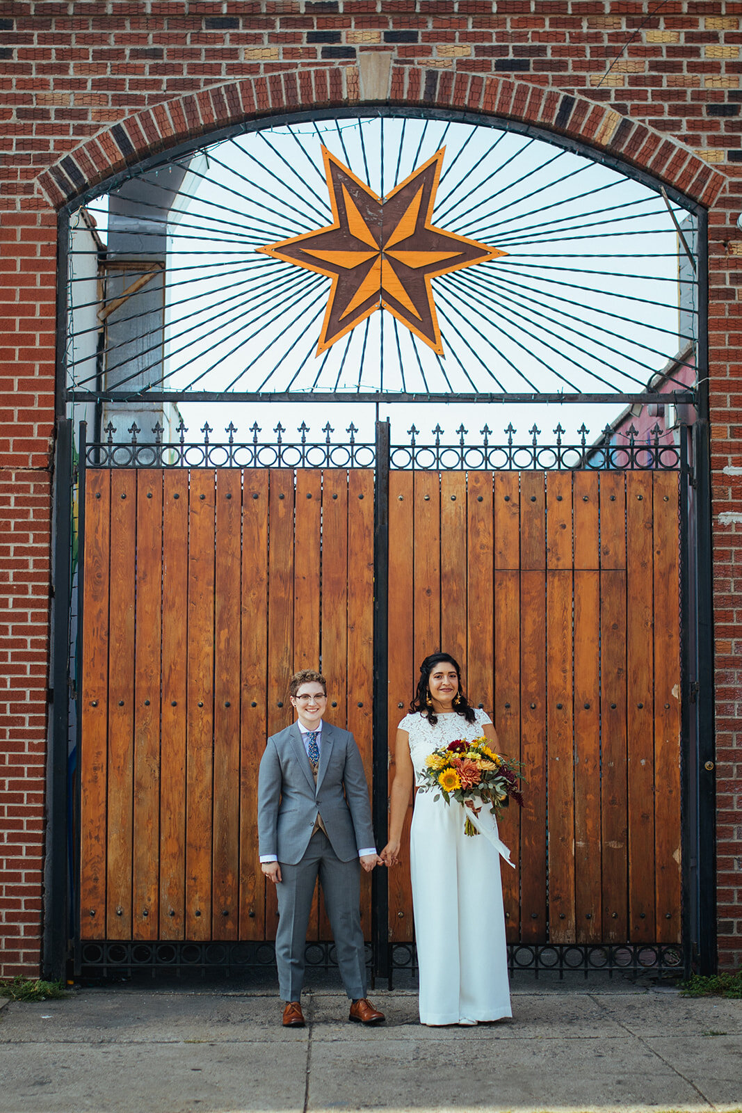 LGBTQ couple holding hands before wedding ceremony in Brooklyn Shawnee Custalow Queer Wedding Photographer