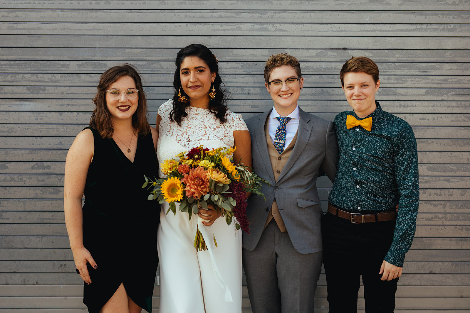 LGBTQ future spouses posing with two wedding guests in Brooklyn Shawnee Custalow Queer Wedding Photographer