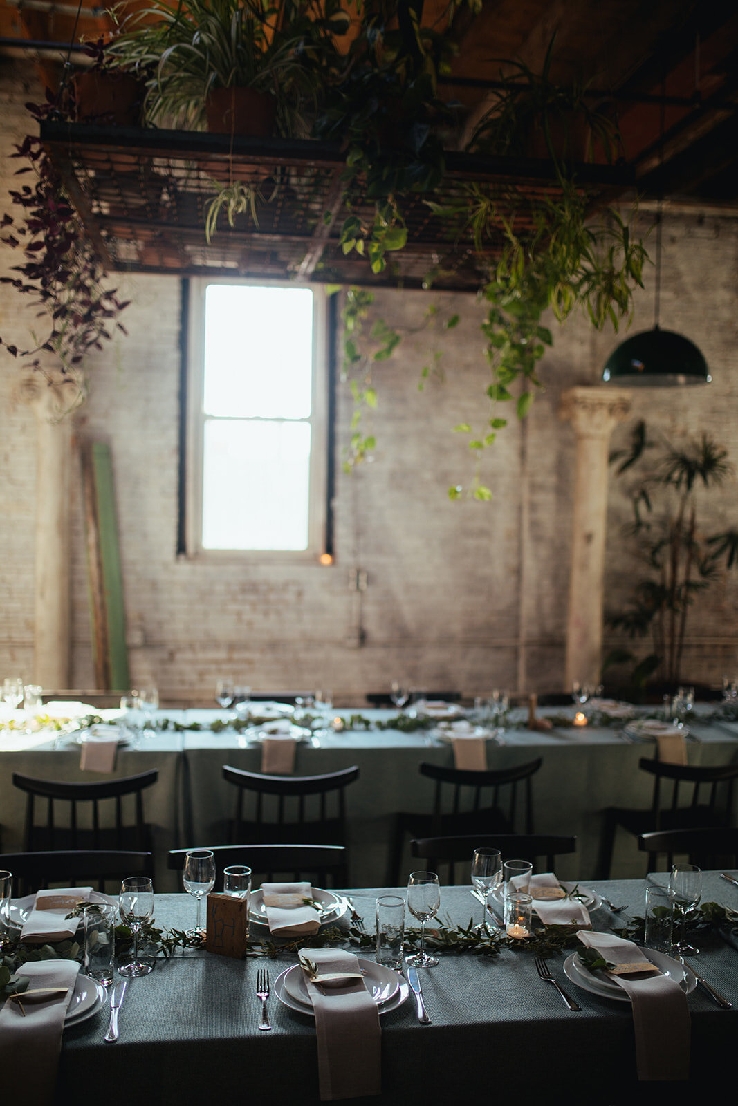 Two tables set for wedding guests at Marlow Events Red Hook Brooklyn Shawnee Custalow Queer Wedding Photographer