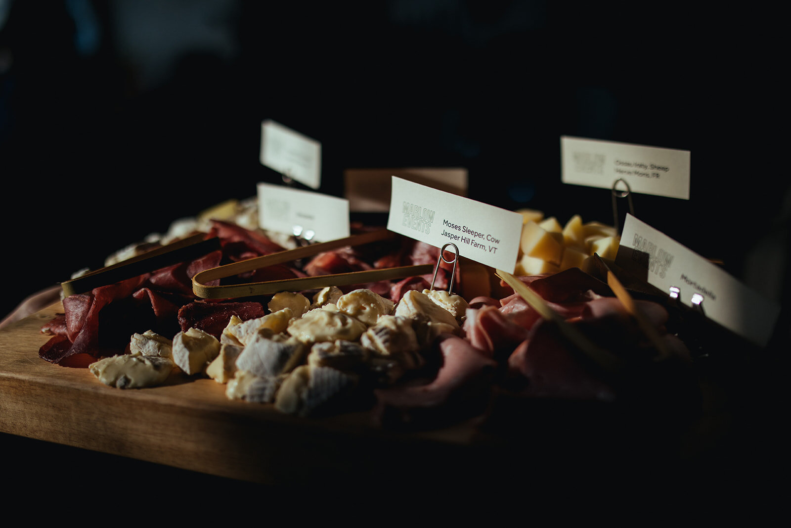 Labeled charcuterie board at wedding reception at Marlow Events Red Hook Brooklyn Shawnee Custalow Queer Wedding Photographer