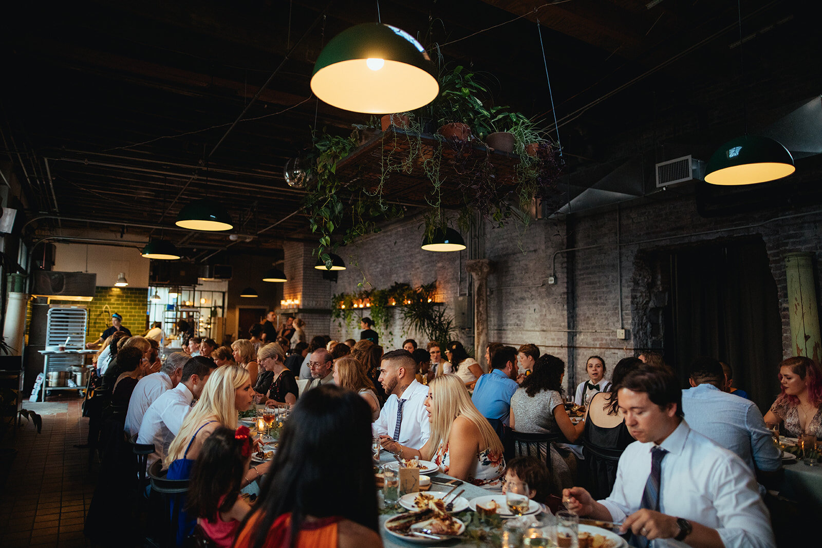 Wedding guests dining at Marlow Events Red Hook Brooklyn Shawnee Custalow Queer Wedding Photographer