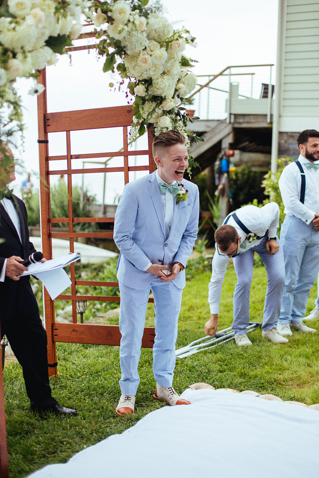 LGBTQ spouse laughing in Annapolis MD Shawnee Custalow wedding photography