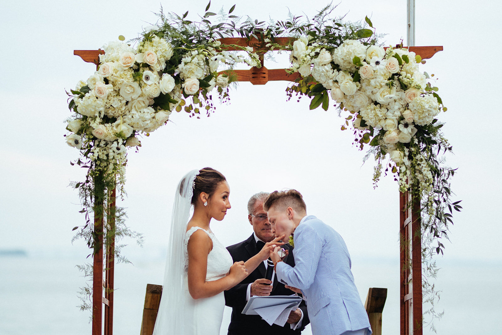 Spouse licking brides finger during ceremony in Annapolis MD Shawnee Custalow Photography