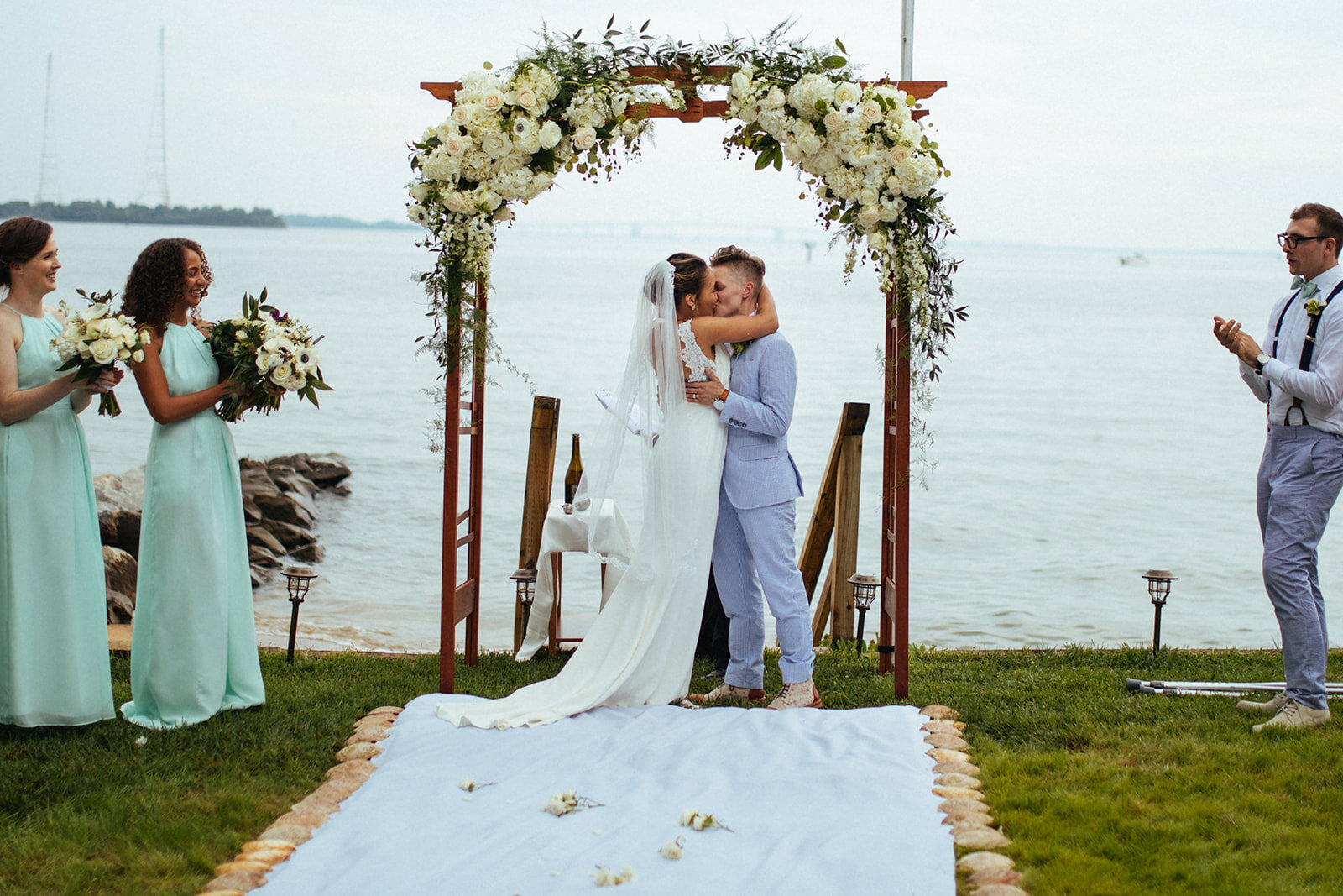 Queer newlyweds kissing by the Chesapeake Bay in Annapolis MD Shawnee Custalow Photography