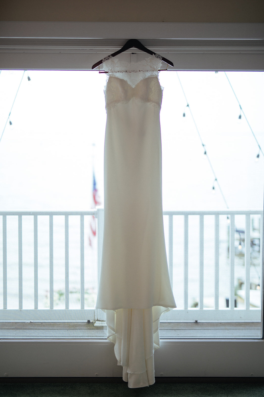 Wedding dress hanging in Annapolis MD Shawnee Custalow Queer Wedding Photography