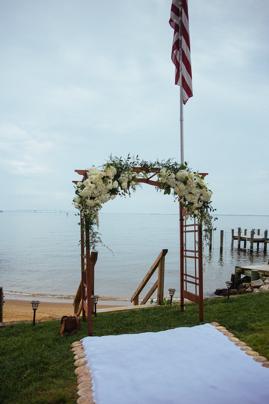 Floral arch by the Chesapeake Bay in Annapolis MD Shawnee Custalow Wedding Photography