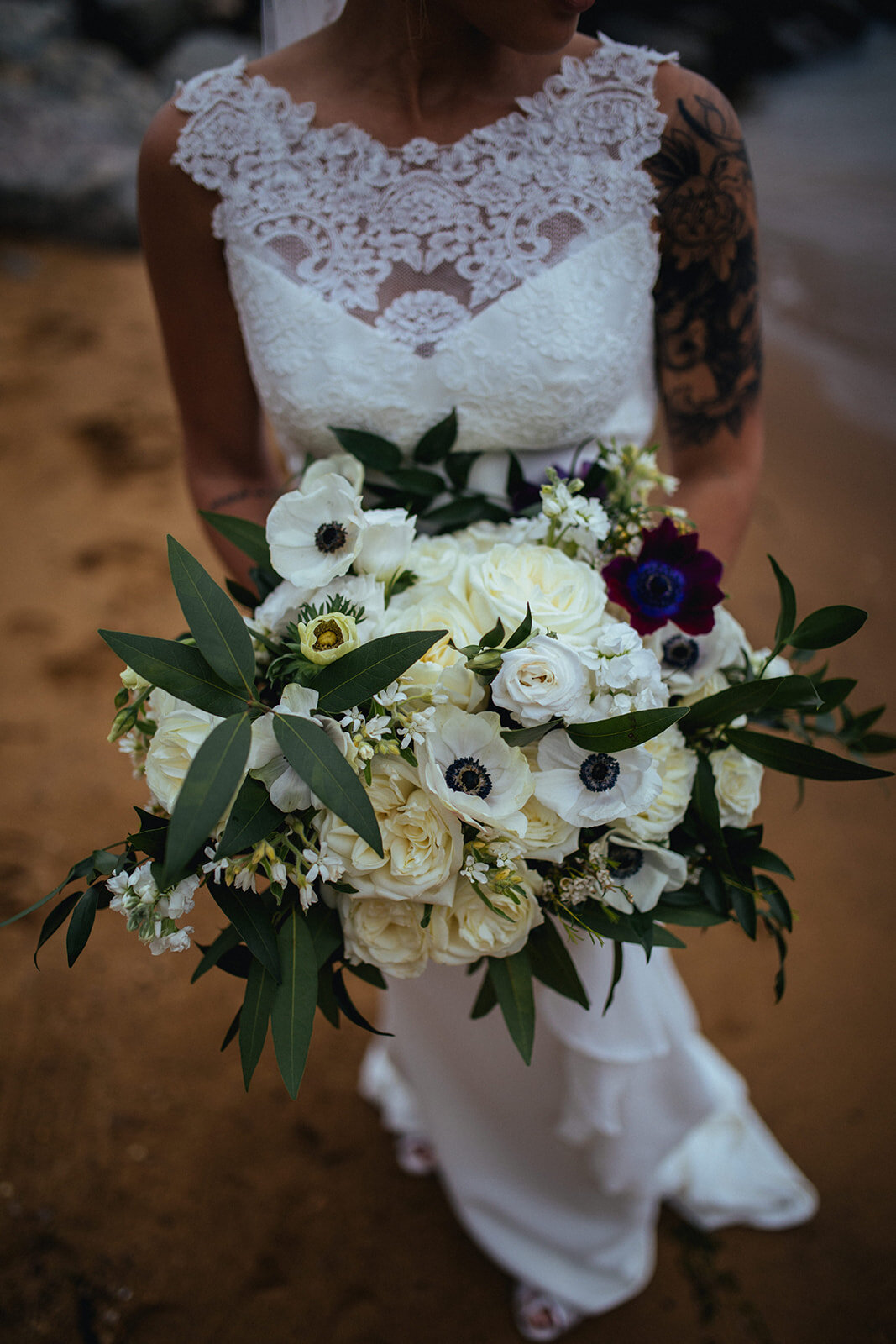 Bride holding white bouquet in Annapolis MD Shawnee Custalow Queer Wedding Photography