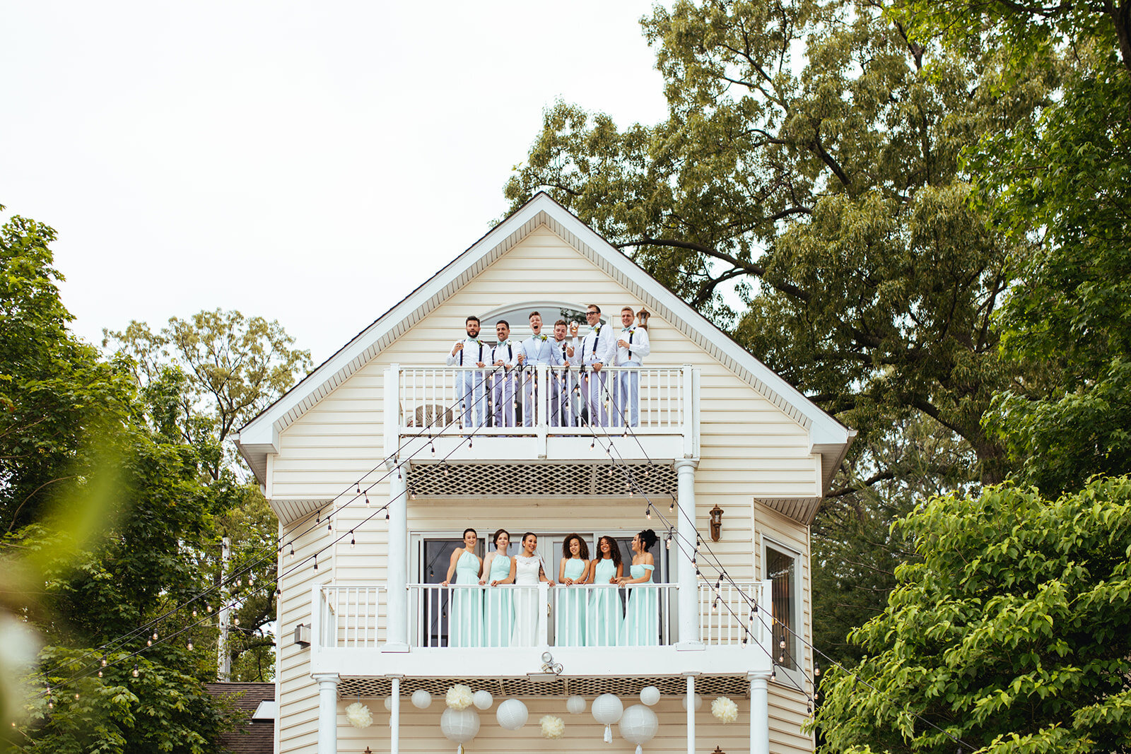 Newlyweds and honor attendants on two balconies in Annapolis MD Shawnee Custalow Photography