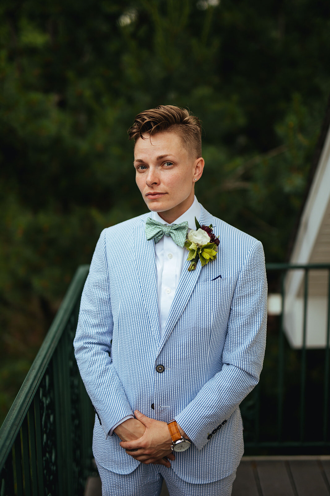 Newlywed spouse in a blue suit in Annapolis MD Shawnee Custalow Queer Wedding Photography