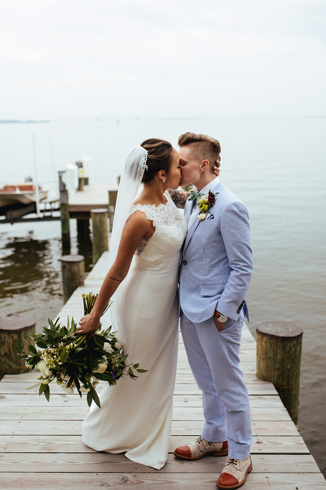 Newlyweds kissing by the Chesapeake Bay in Annapolis MD Shawnee Custalow Photography