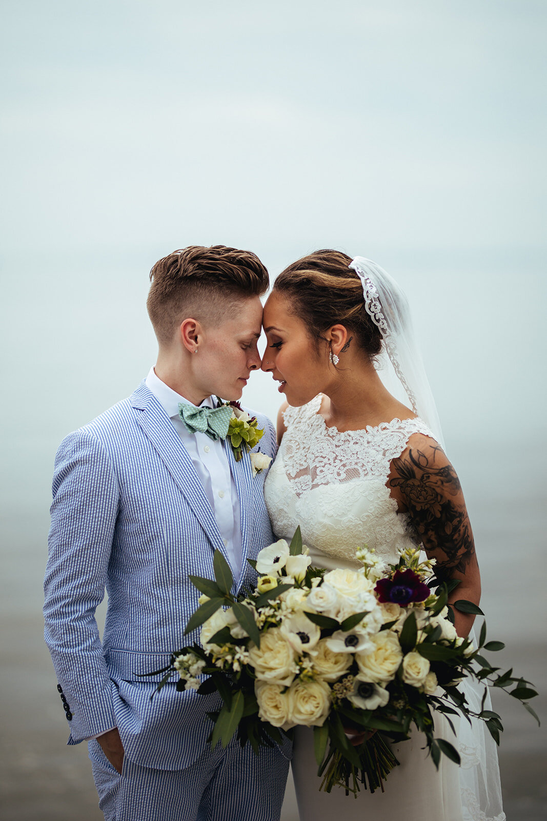 Newlyweds lean in for a kiss in Annapolis MD Shawnee Custalow Queer Wedding Photography