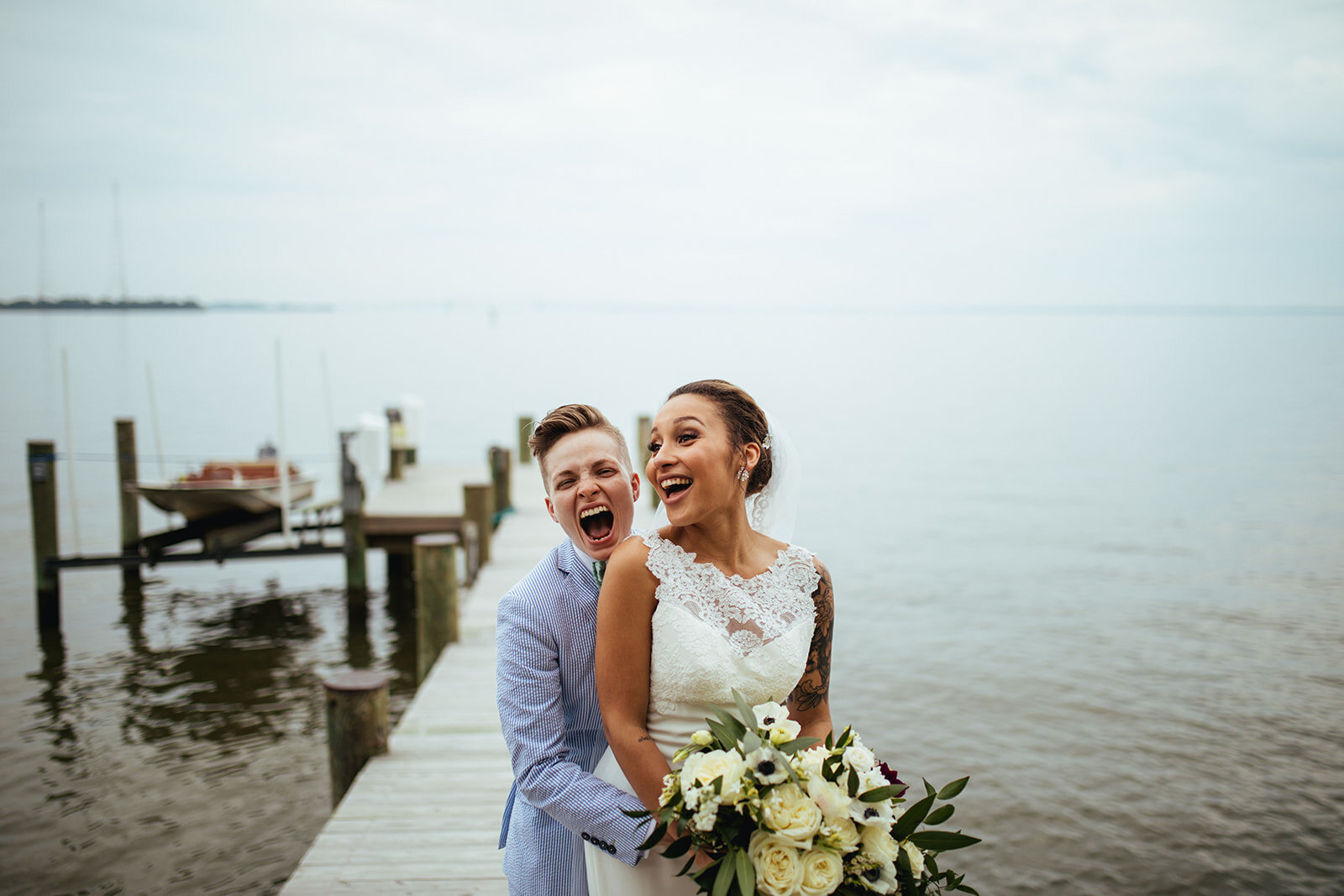 Newlyweds embracing by the Chesapeake Bay Annapolis MD Shawnee Custalow Photography