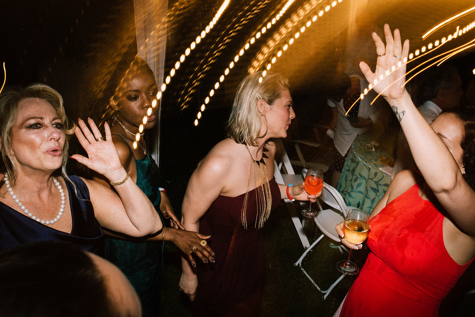 Wedding guests dancing in Annapolis MD Shawnee Custalow Queer Wedding Photography