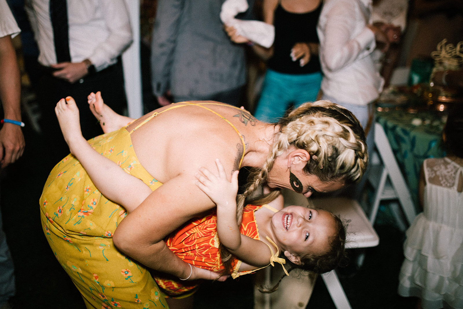 Wedding guest dancing with a child in Annapolis MD Shawnee Custalow Photography