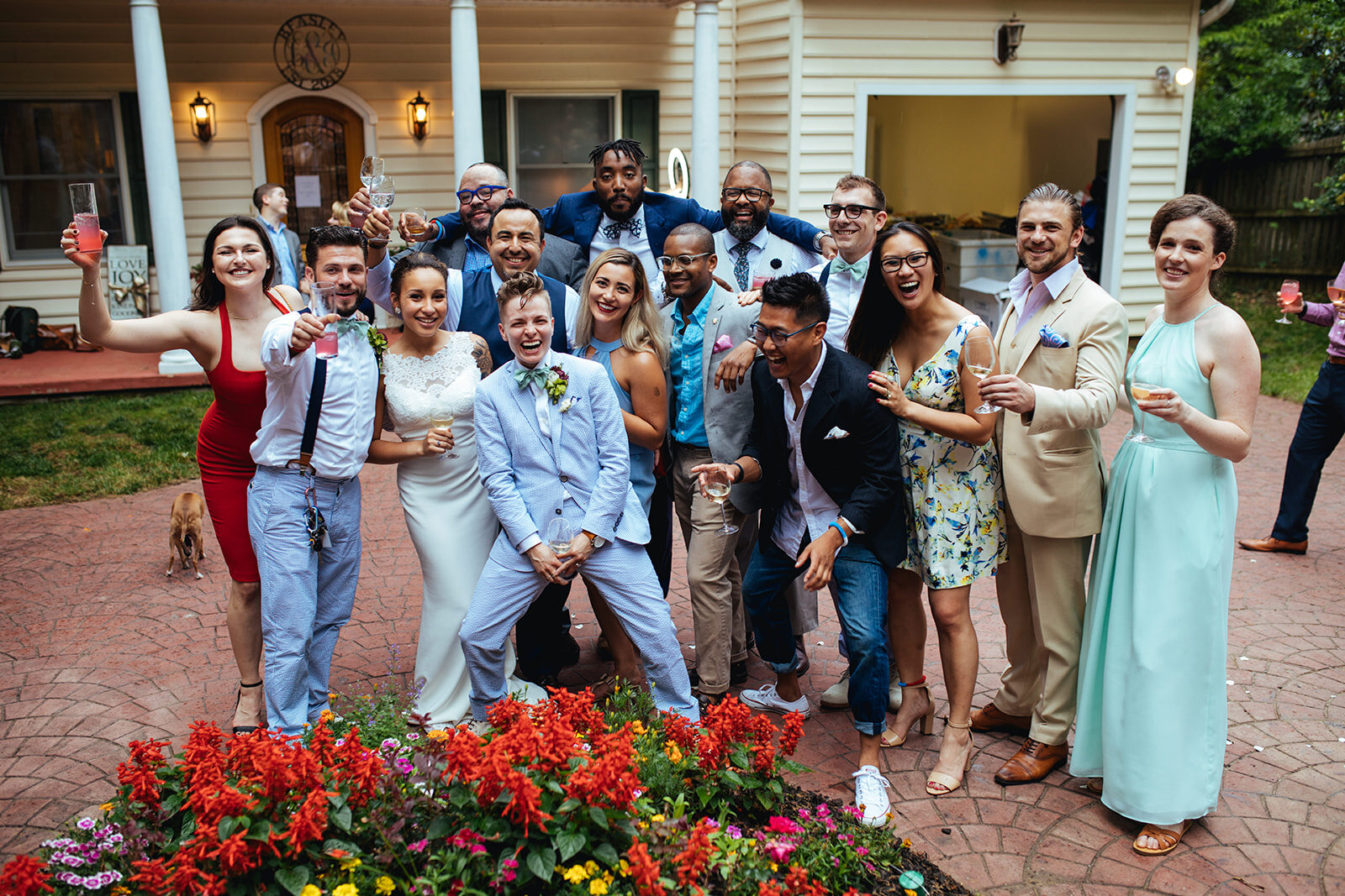 Newlyweds posing with guests in Annapolis MD Shawnee Custalow Queer Wedding Photography