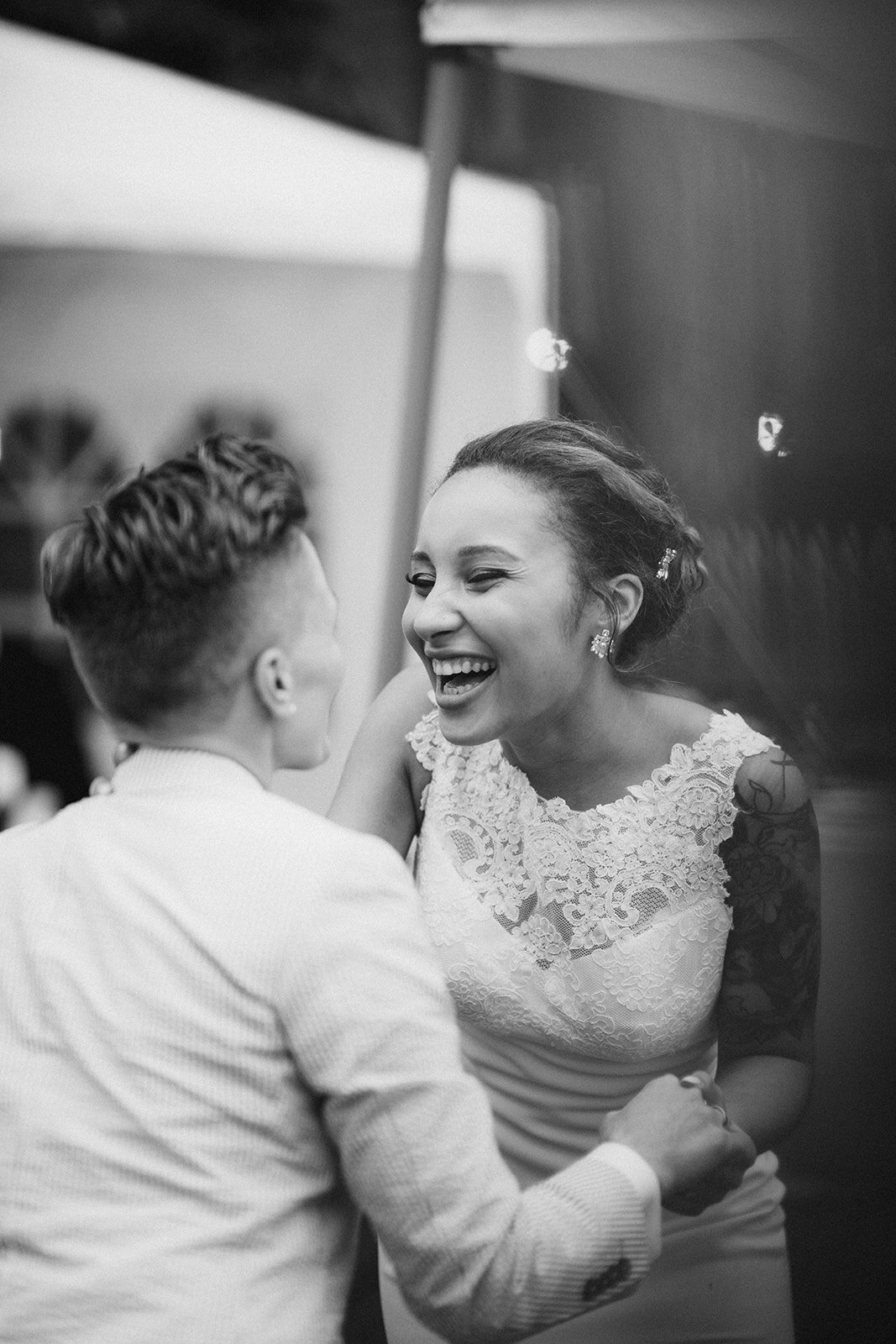 Newlyweds laughing in Annapolis MD Shawnee Custalow Queer Wedding Photography