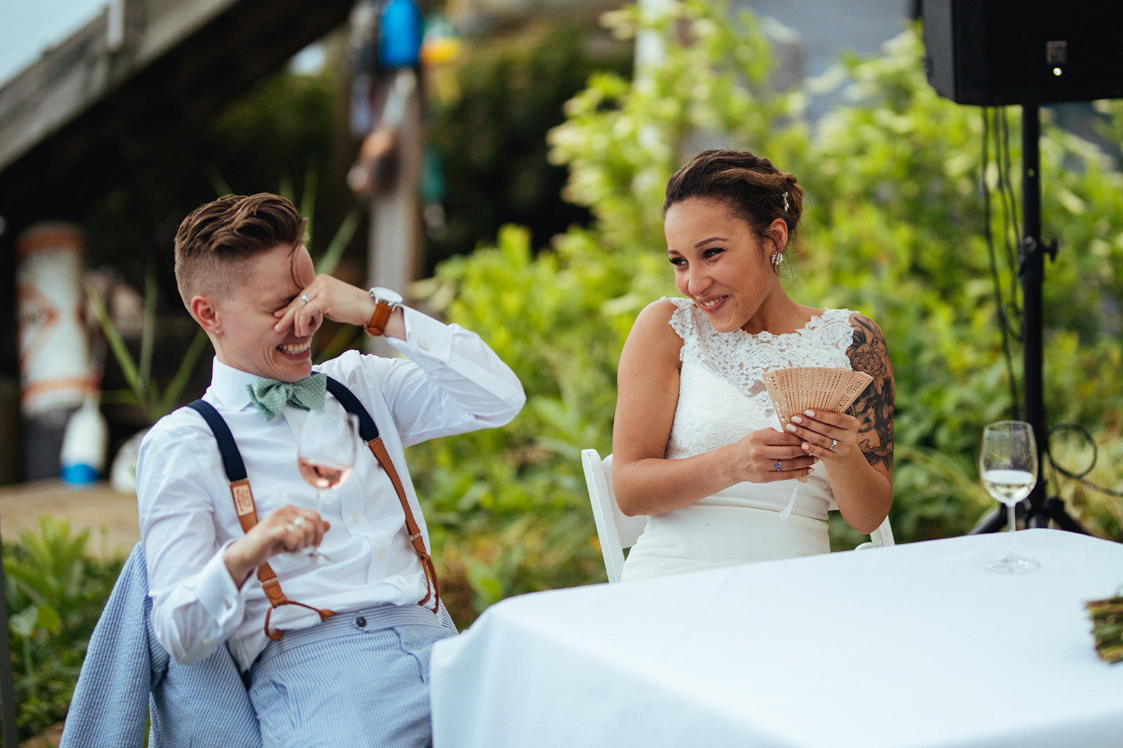 LGBTQ newlyweds laughing in Annapolis MD Shawnee Custalow Queer Wedding Photography