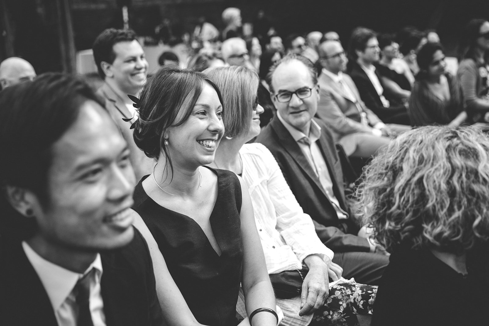 Weddings guests smiling before backyard wedding ceremony in Los Angeles Shawnee Custalow Photography