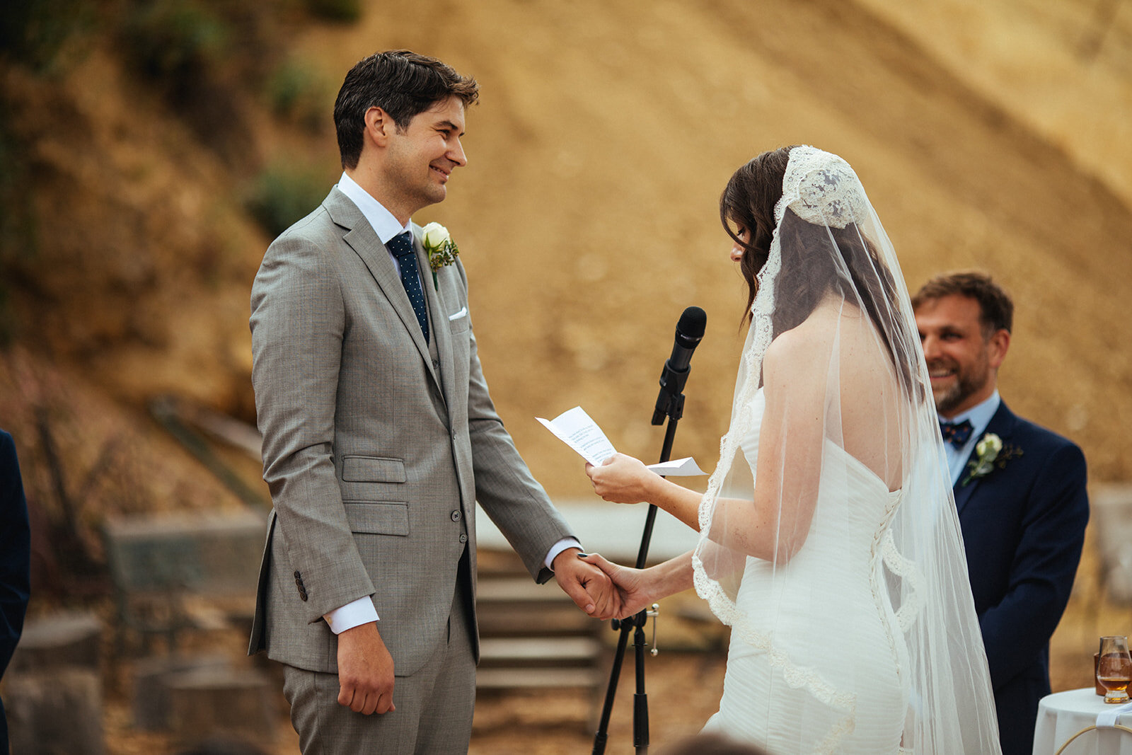 Bride reading vows to groom during ceremony in Studio City LA Shawnee Custalow Queer Wedding Photography